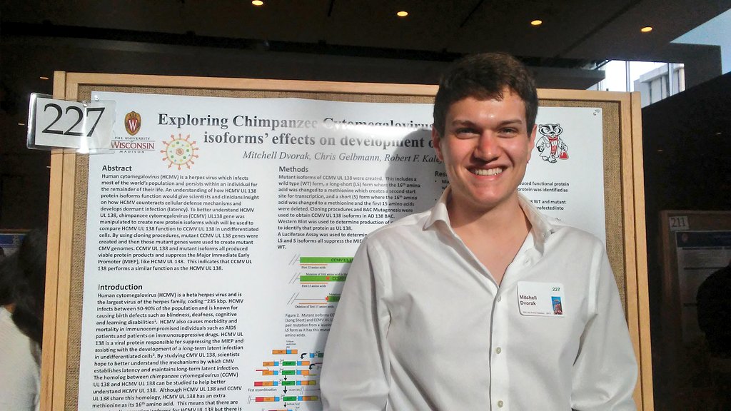 Mitchell presenting his research poster
