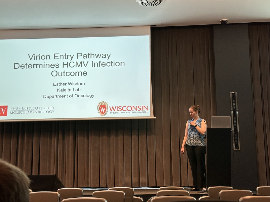Esther giving a research presentation at an international conference
